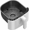 A close-up, angled view of an empty air fryer basket and its outer casing, set against a white background. Náhľad obrázku produktu