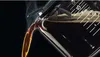 Hot coffee being poured from a carafe. Náhled obrázku produktu
