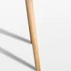 A close-up shot of a light brown wooden furniture leg against a white background. Produktbild-Vorschau