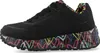A side view of a black sneaker with a colorful, graffiti-like pattern on the sole and lining. Náhled obrázku produktu