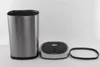 A stainless steel trash can with its lid and a rubber ring are displayed separately against a white background. Produktbild-Vorschau
