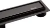 A close-up, angled view of a black linear shower drain with the brand name BALNEO visible on the surface. Podgląd zdjęcia produktu