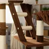 Close-up view of a brown and beige cat tree with scratching posts and platforms. Produktbild-Vorschau