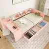 A pink Jugendbett (youth bed) with integrated desk and storage drawers, shown in a bedroom setting. Náhľad obrázku produktu