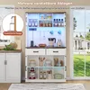 A white buffet cabinet with a brown countertop and various kitchen items displayed inside, set in a bright kitchen with a window view of a house and lawn. Podgląd zdjęcia produktu
