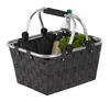 A shopping basket with a bottle and lettuce inside, on a white background. Produktbild-Vorschau