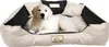 A golden retriever puppy lying in a dog bed. Voir les images du produit