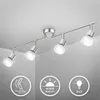 A ceiling light fixture with four adjustable spotlights is shown against a white ceiling and gray wall. Anteprima dell’immagine prodotto