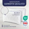 Two white pillows with blue trim are shown, with close-up details and certifications. Produktbild-Vorschau