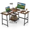 An L-shaped desk with a laptop, monitor, keyboard, and shelves. Produktbild-Vorschau