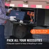 A person is placing a toolbox into a storage compartment on the side of a truck. Anteprima dell’immagine prodotto