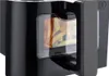 A close-up shot of a black air fryer with french fries visible through a transparent window. Voir les images du produit