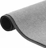 A rolled-up gray carpet with a black rubber backing. Podgląd zdjęcia produktu