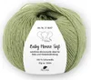 A ball of green yarn with a label attached. Produktbild-Vorschau