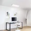 A modern office or study space with a desk, computer, chair, and artwork on the wall, illuminated by a ceiling light. Anteprima dell’immagine prodotto