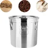 A stainless steel food storage container with three circular insets showing rice, coffee beans, and grains. Náhled obrázku produktu