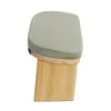 A side view of a meditation stool with a gray cushion and a wooden base. Náhled obrázku produktu