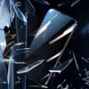 A smartphone is shown surrounded by shattered glass, suggesting durability or impact resistance. Podgląd zdjęcia produktu