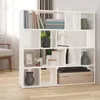 A white bookshelf filled with decorative items and books, placed in a room with natural light. Podgląd zdjęcia produktu