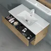 A bathroom vanity with a sink and an open drawer filled with toiletries and makeup. Produktbild-Vorschau