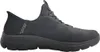A side view of a black Skechers slip-on shoe against a white background. Voir les images du produit