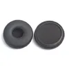 Two black headphone ear pads are shown against a white background. One ear pad is shown from the top, revealing the inner cushioning. The other ear pad is shown from the bottom, revealing the attachment mechanism. Produktbild-Vorschau
