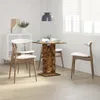 A dining set with a square table and four chairs in a room with white walls and blinds. Produktbild-Vorschau