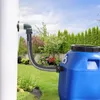 A blue rain barrel connected to a downspout in a garden. Produktbild-Vorschau