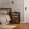 A bedroom scene featuring a nightstand next to a bed. Produktbild-Vorschau