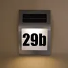 A solar-powered house number light with the number '29b' illuminated. Produktbild-Vorschau