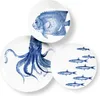 Three ceramic plates with blue marine life illustrations on a white background. Podgląd zdjęcia produktu