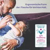 A father feeding his baby with a bottle on a couch. Podgląd zdjęcia produktu
