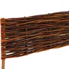 A close-up view of a woven willow border for a garden bed. Produktbild-Vorschau