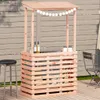 An outdoor bar setup with bottles and glasses on a wooden deck, with a fence in the background. Produktbild-Vorschau