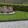 A garden scene with a black metal lawn edge separating a gravel path from a lawn and a flower bed. Produktbild-Vorschau