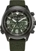 A close-up, front-facing studio shot of a green Citizen Eco-Drive watch with a black case and a green fabric strap. Podgląd zdjęcia produktu