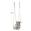 A child's swing hanging from chains. Produktbild-Vorschau