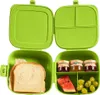 An open green lunchbox filled with food items. Produktbild-Vorschau