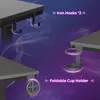 Close-up view of a gaming desk's features, including hooks and a cup holder, against a purple smoky background. Anteprima dell’immagine prodotto