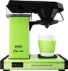 A close-up studio shot of a Moccacmaster coffee maker with a cup. Produktbild-Vorschau