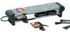 A raclette grill with a stone top and several small pans underneath. Produktbild-Vorschau