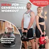 A man and a woman are posing with adjustable kettlebells. Produktbild-Vorschau