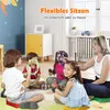 Children and an adult sitting on the floor in a room, playing with musical instruments. Produktbild-Vorschau