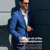 A man in a blue suit wearing sunglasses and a headset clipped to his lapel, leaning against a wall. Produktbild-Vorschau