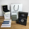 A collection of Seiko watch packaging and documentation, including boxes, a shopping bag, and warranty information, with a watch visible in one of the boxes. Podgląd zdjęcia produktu