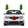 A silver car decorated for Christmas with two plush Christmas trees on the roof and a red star on the grille. Podgląd zdjęcia produktu