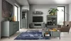 A modern living room with a sofa, coffee table, and entertainment center. Náhled obrázku produktu