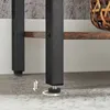 A close-up view of the adjustable feet of a shelf unit, showing the metal frame and a wooden shelf. Produktbild-Vorschau
