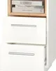 A close-up view of a white bedside table with two drawers and a small shelf above containing books. Náhled obrázku produktu