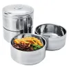 A set of stainless steel food containers, with one container filled with food. Produktbild-Vorschau